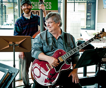 Brian Kelly playing guitar